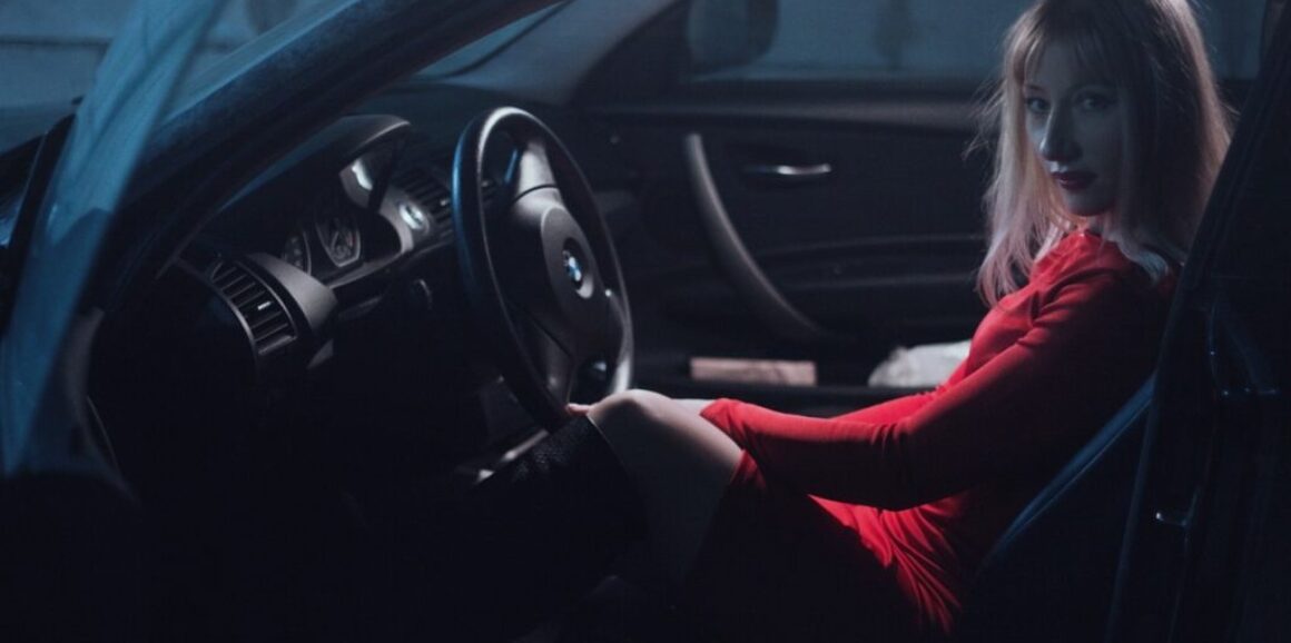 girl in car in red dress 1382916